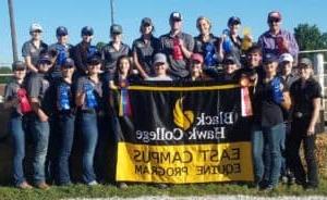 Group of students with ribbons & East Campus Equine Program banner